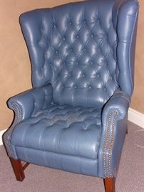 Blue leather reclining wing back chair with nailhead trim