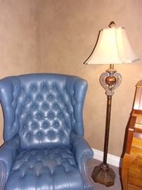 Blue leather reclining wing back chair with nailhead trim