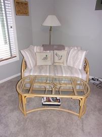 Rattan Loveseat and coffee table with cushions and also two counter height / Rattan bar stools