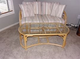 Rattan Loveseat and coffee table with cushions and also two counter height / Rattan bar stools