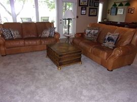 Buckskin leather roll armed living room set with Two Sofas/Couch, Chair, and Ottoman. Your family room will never feel better!