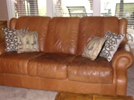 Buckskin leather roll armed living room set with Two Sofas/Couch, Chair, and Ottoman. Your family room will never feel better!