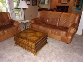 Buckskin leather roll armed living room set with Two Sofas/Couch, Chair, and Ottoman. Your family room will never feel better!