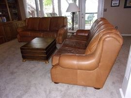 Buckskin leather roll armed living room set with Two Sofas/Couch, Chair, and Ottoman. Your family room will never feel better!
