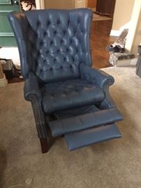Blue leather reclining wing back chair with nailhead trim