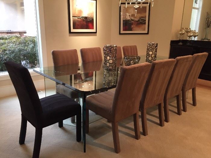 Beautiful large modern triple beveled thick glass dining table , with 10 chairs. Two chairs are black. Mint condition, Table is 9 ft. in length. $1800