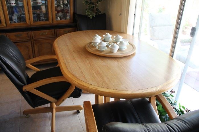 Dining table with leaf. Three leather chairs