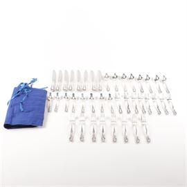 Gorham "Baronial-New" Sterling Flatware: A group of sterling flatware in the Baronial-New pattern by Gorham. There are forty pieces in total including eight dinner knives with stainless blades and hollow handles, eight tablespoons, eight teaspoons, eight dinner forks, and eight salad forks. They contain scrollwork, beading, and floral accents to the handles with hallmarks to the reverse. The total approximate weight, excluding the knives with stainless blades and hollow handles, is 53.200 ozt.
