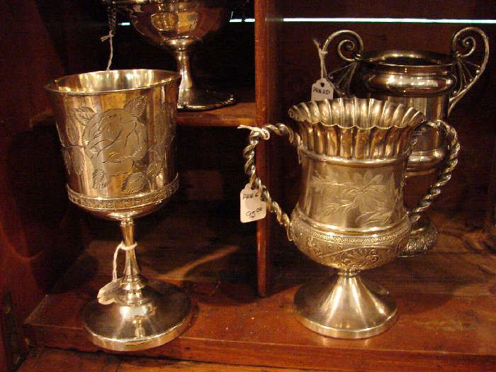Several loving cups, turn of the century and late 19th century. Silver plate. Small.