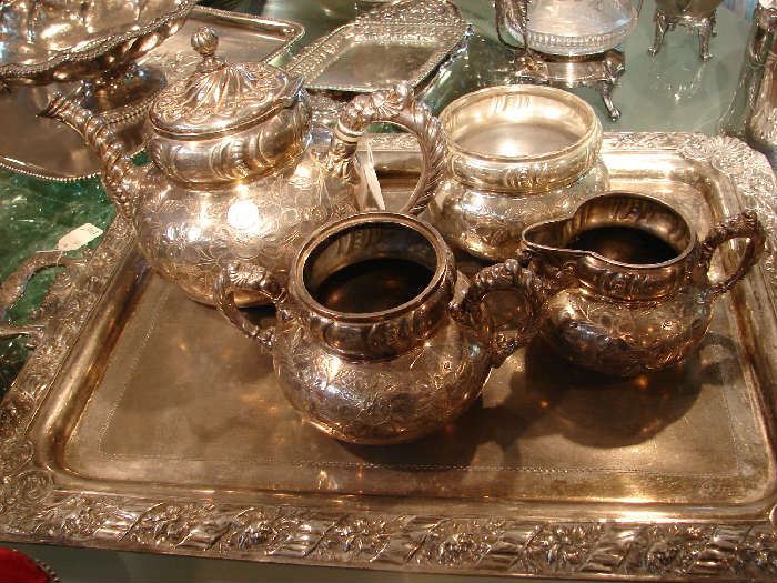 One of several coffee and tea services. None have matching trays, and several do not have trays.