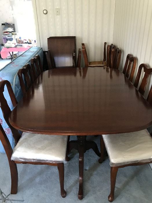 Pennsylvania House 3.  Cherry Wood. Great condition.  A couple small stains and nicks.  12 chairs in excellent condition (still have plastic on cushions).  One chair has spot on finish.  Includes 3 leaves to comfortably fit 12.  