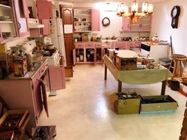 Huge Second Kitchen Filled with Dishes and Small and Large Appliances including Portable Dishwasher