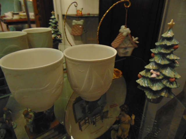 Lladro votive cups, Christmas tree, and "Welcome Home" birdhouse.