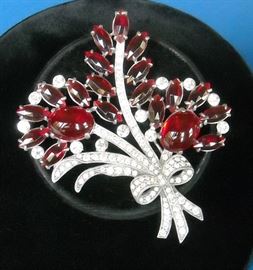 A very old Eisenberg brooch. Marked with the script E.  It's as big as my hand and perfect!