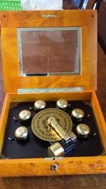 Mr. Christmas Musical Bell Symphonium in Burl Wood Box plus 19 Discs and Key to Lock. Works and sounds beautiful. 