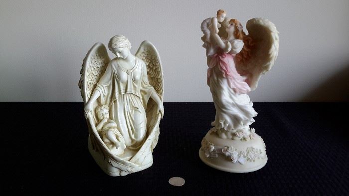 Angel and Child Figurines. One on Right is Musical.