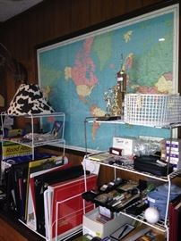 Large world map and office supplies