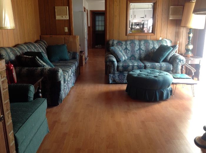 4 piece living room set - couch, love seat, side chair and ottoman.  The chairs were used but covered with sheets.  The ottoman and throw pillows are brand new.  They were recently found covered and stored in another room. 