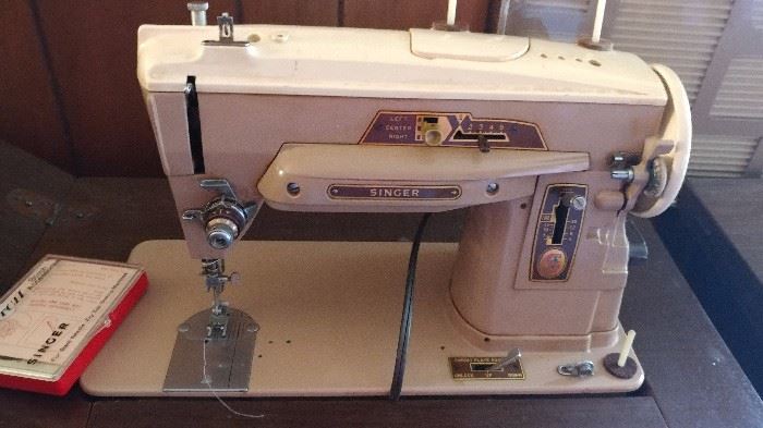 Singer sewing machine in a cabinet