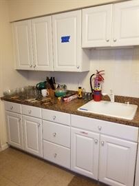 Lots of clean white kitchen cabinets