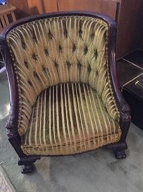 Tufted, carved armchain with dolphin handrests, as is