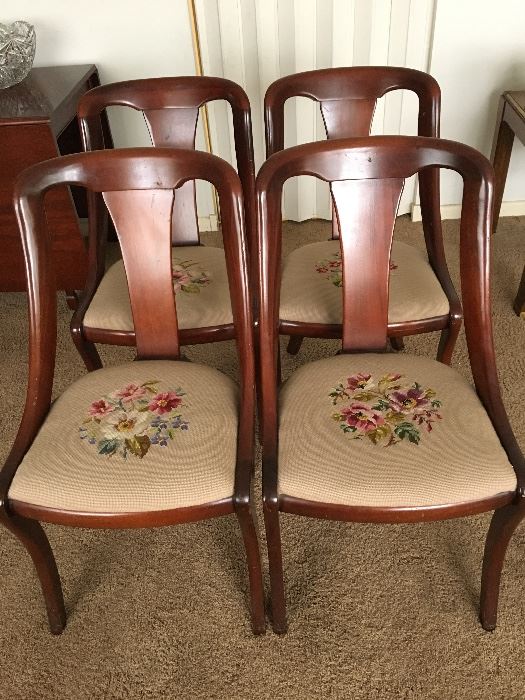 A set of mahogany mid-century chairs with needlepoint seats 