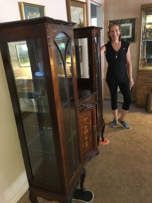 My lovely wife standing next to curio/ sideboard with inlay.
