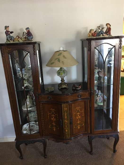 Antique curio sideboard with inlay and carving.