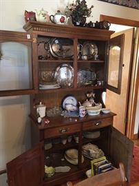 nice china cabinet filled with various glass ware items 
