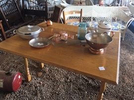 nice oak table with various cooking and baking items