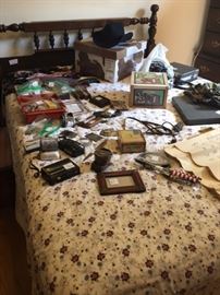 #1 of 4 pc. bed room suite with various items on bed from picture frames to cigar boxes and much more
