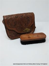 Tooled leather bag and brush