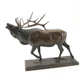 David Daniels Cast Bronze Bull Elk Statuette: A cast bronze bull elk statuette by American wildlife artist David Daniels (b.1948). The statuette features a naturalistic depiction of a calling male elk. It rests on a rectangular base and is marked “Daniels 1985” in the mold to the base.