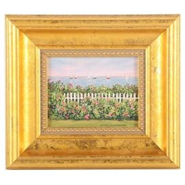 Christie Cardillo Velesig Oil Painting "Cape Gardens": An oil painting on canvas by listed artist Christie Cardillo Velesig (American, b. 1948) titled Cape Gardens. This painting depicts a body of water to the background with small sailboats, and to the foreground a lush garden with green and pink bushes and a white picket fence. The painting is signed by hand to the lower right corner and is housed in a gold tone wooden frame. To the verso of the frame is a pamphlet with information about the artist.
