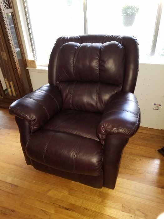 Brand new matching pair of rocker leather recliners