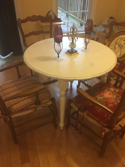 Round wooden table and 4 chairs, candle holders