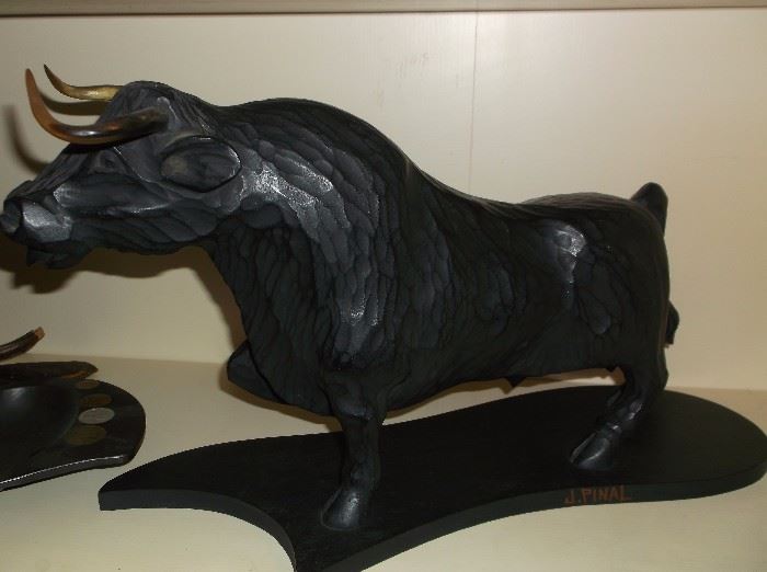 Carved bull signed J. Pinal