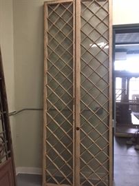 A pair of French wood tru- divided lites conservatory  doors
