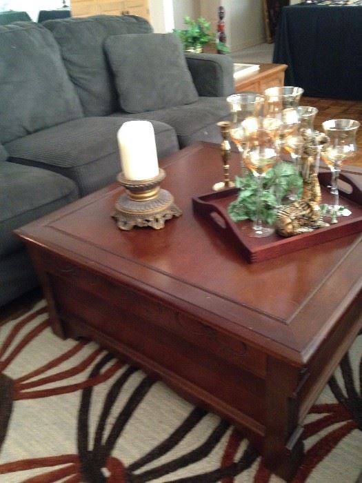 Two tiered square coffee table; 3-cushion sofa has a matching love seat