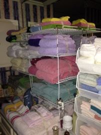 Many towels, sheets, and other linens