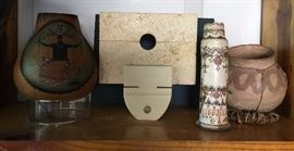 center: 2-Piece Texas Shell Stone Sculpture by Arlo Namingha; left:  Apache Spirit Dance Gourd; right of center Zuni Pictorial Pottery Candlestick
