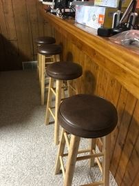 Oak cushioned bar stools.