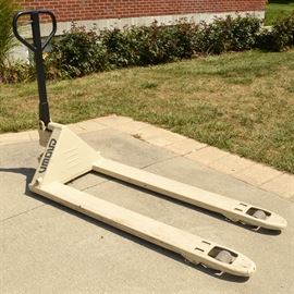 Crown Industrial-Grade Pallet Jack: A Crown industrial-grade manual pallet jack with extra-long forks and a positionable handle. Please bring assistance for moving this item.