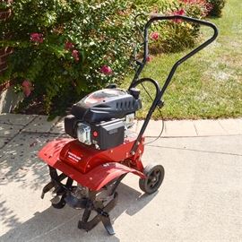 Southland Gas Engine Rotary Tiller: A Southland gas engine front tine rotary tiller, model SFTT140, with the original owner’s manual.
