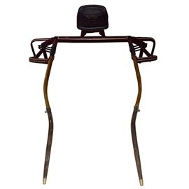Harness Horse Race Sulky: A harness horse race sulky frame used in racing harness horses. It features a padded black leather-wrapped seat, and a metal and wooden frame. No wheels are included.