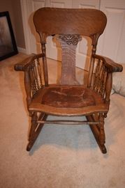 Antique Golden Oak Rocker with Spindle Arms and Leather Seat
