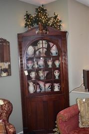 Country Corner Cabinet Full of Hull Pottery and Adorned with 5 Lighted Christmas Trees