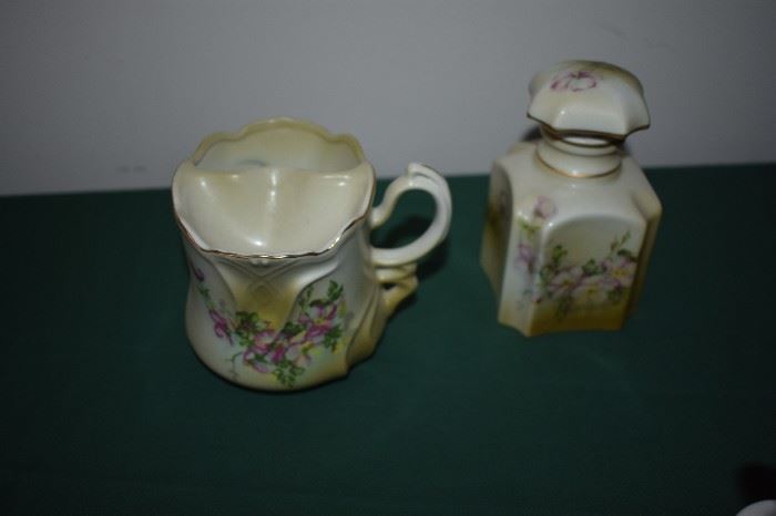 Hand Painted Nippon most in Bisque Finish pictured here: Nippon Mustache Cup and Fancy Dresser Bottle