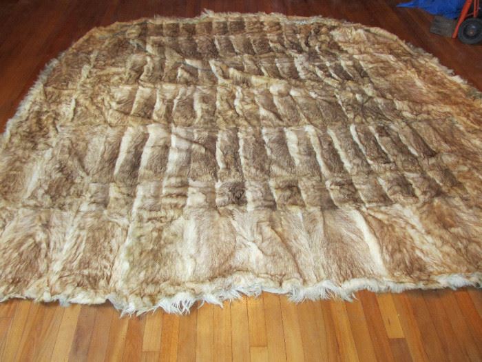 Hand made rabbit pelt rug 8ft by9ft. Believe to be American Indian made