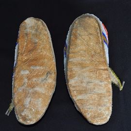 Sioux beaded moccasins on parfleche c. 1890-1900